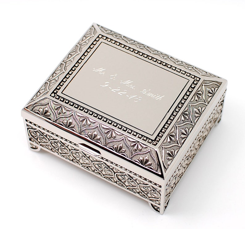 May include: A silver metal keepsake box with an ornate design and an engraved inscription that reads "Mr. & Mrs. Smith 9-22-13".