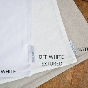 May include: Three fabric swatches in different shades of white. The swatches are labeled "Bright White", "Off White Textured", and "Natural".