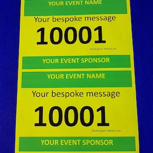 May include: A yellow and green race bib with the text "YOUR EVENT NAME" and "YOUR EVENT SPONSOR" in green. The number "10001" is printed in black on the bib. The text "Your bespoke message" is printed in black on the bib.