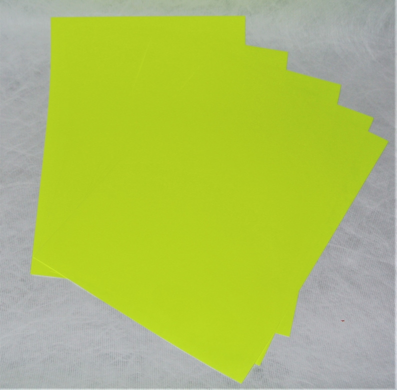 May include: Stack of bright neon green cardstock paper.
