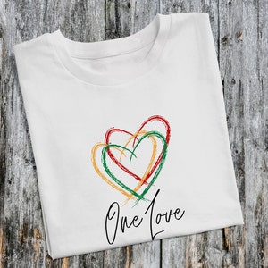 May include: White t-shirt with a green, red, and yellow heart design and the text "One Love" printed on the front.