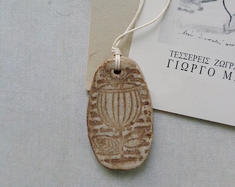 Beige ceramic handmade pendant, necklace with flower imprint. Unique gift for her.