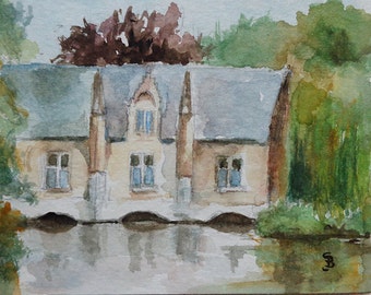 House on lake watercolor painting.
