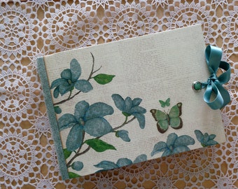Floral scrapbook photo album. Journal with flowers, butterflies and birds.