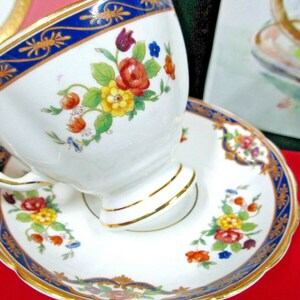 Tuscan tea cup and saucer Floral rose cobalt blue teacup England 1940s painted