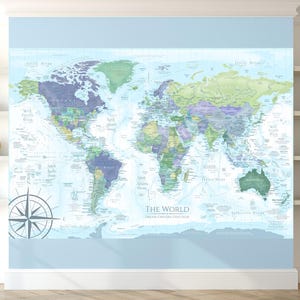 May include: A light blue world map with green, purple, and yellow accents. The map is labeled "The World" and includes a compass rose.