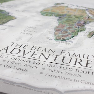 May include: A white world map with a black title that reads "The Bean Family Adventures". The text below the title reads "Life is a journey best traveled together" and lists "Jeffrey's Travels", "Our Travels", "Yukie's Travels", and "Adventures to Come".