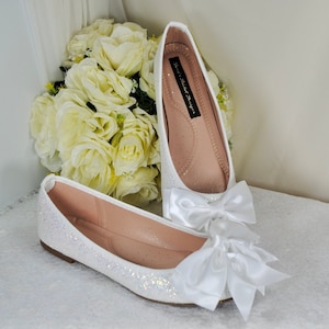 Wide fit white flat shoes hotsell