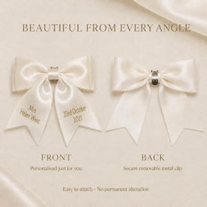 May include: Two ivory satin bows with tails. The left bow features gold text reading Mrs Helen West and 23rd October 2021. The right bow shows a silver metal clip on the back. Text on the image includes BEAUTIFUL FROM EVERY ANGLE, FRONT, BACK, Personalised just for you, Secure removable metal clip, and Easy to attach - No permanent alteration.