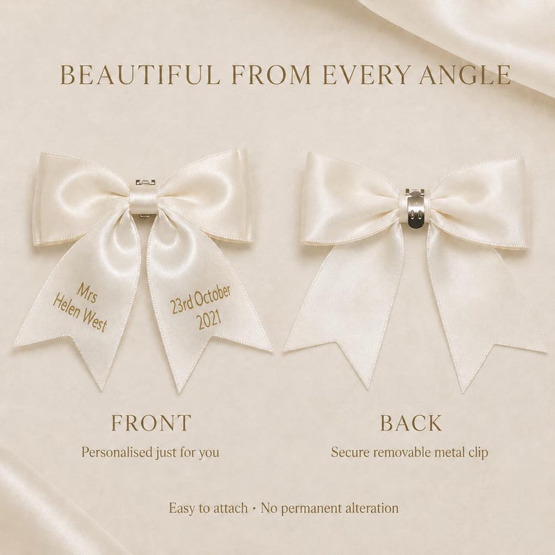 May include: Two ivory satin bows with tails. The left bow features gold text reading Mrs Helen West and 23rd October 2021. The right bow shows a silver metal clip on the back. Text on the image includes BEAUTIFUL FROM EVERY ANGLE, FRONT, BACK, Personalised just for you, Secure removable metal clip, and Easy to attach - No permanent alteration.