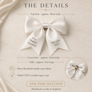 May include: A white satin hair bow featuring the text Mrs Walker Brookes and 19th June 2022. The bow measures approximately 10cm wide at the top and 11cm wide at the bottom with 7cm long tails. It includes a metal clip and 35mm Berisfords double satin ribbon.