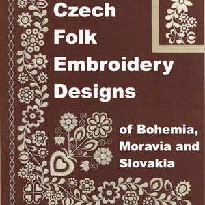 May include: A book cover with the title "Czech Folk Embroidery Designs" in white text on a brown background. The cover features floral embroidery designs in white, with the text "of Bohemia, Moravia and Slovakia" below.