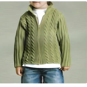 May include: A green cable knit sweater with a zip fastening. The sweater has a ribbed texture and a relaxed fit.