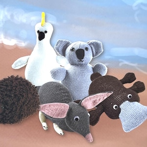 May include: Five knitted stuffed toys, including a koala, a platypus, an echidna, a cockatoo, and a hedgehog. The toys are all different colours and have different features.