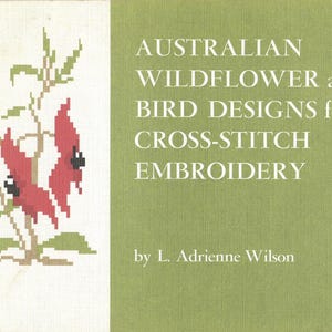 May include: A book cover with cross-stitch designs. The left side shows a cross-stitch image of red flowers with black details and green leaves. The right side has text: "AUSTRALIAN WILDFLOWER and BIRD DESIGNS for CROSS-STITCH EMBROIDERY".
