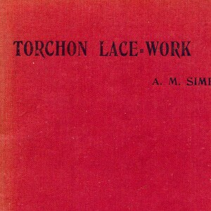 May include: A red book with the title "TORCHON LACE-WORK" and the author's name "A. M. SIME" printed on the front cover.