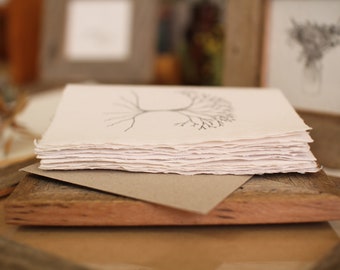 Three handmade paper cards, including three recycled envelopes, botanical cards and animal cards