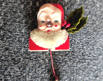 Ozdobna, świecąca broszka ze świętym Mikołajem w kształcie nosa - z baterią - przetestowana i działa!