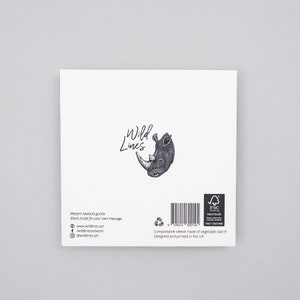May include: A white greeting card featuring a detailed black and white illustration of a rhinoceros head and the words "Wild Lines." The card includes text about the Western lowland gorilla and is blank inside for a personal message.