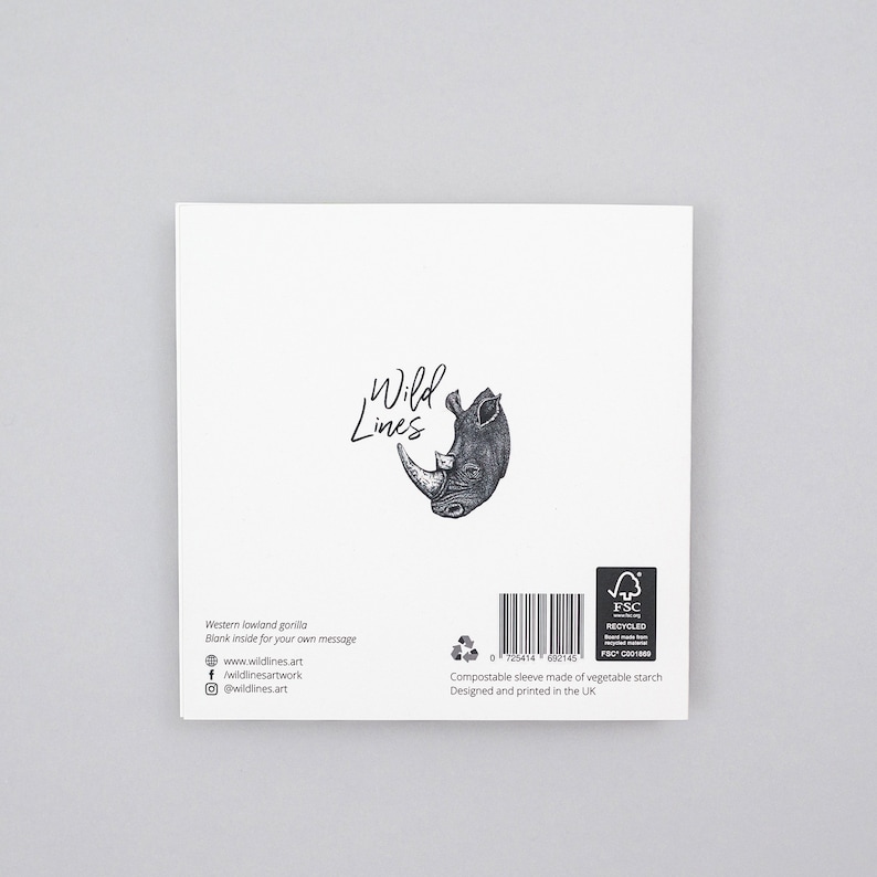 May include: A white greeting card featuring a detailed black and white illustration of a rhinoceros head and the words "Wild Lines." The card includes text about the Western lowland gorilla and is blank inside for a personal message.