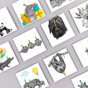 May include: A set of ten greeting cards featuring various animals wearing party hats. The animals include a panda, a koala, a sloth, a frog, a capybara, a giraffe, a meerkat, an axolotl, a bat, and an alligator. The cards are all white with black outlines and colorful accents.