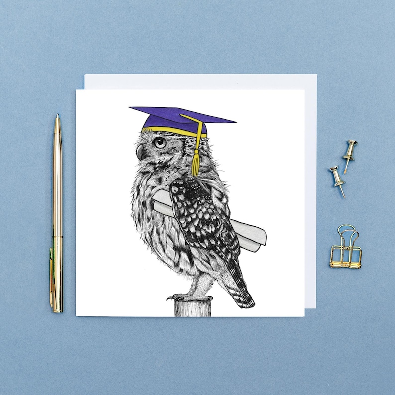 May include: A graduation card featuring a detailed black and white illustration of an owl wearing a purple graduation cap with a gold tassel and holding a diploma. The card is square and set against a light blue background.