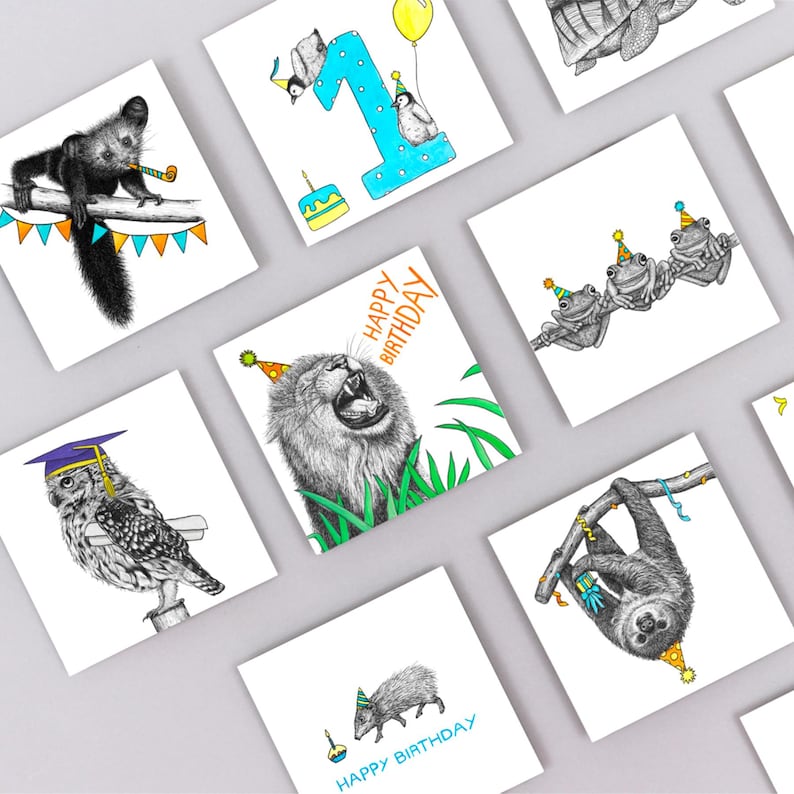 May include: Square greeting cards with animal illustrations, including a lion, owl, and sloth, each wearing a party hat. Some cards have "Happy Birthday" text. The cards are white with black and color illustrations.