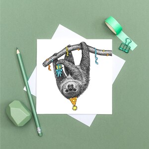 May include: A black and white illustration of a sloth wearing a party hat and holding a gift, hanging upside down from a branch with colorful streamers.