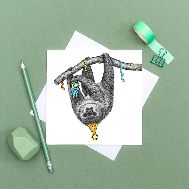 May include: A black and white illustration of a sloth wearing a party hat and holding a gift, hanging upside down from a branch with colorful streamers.