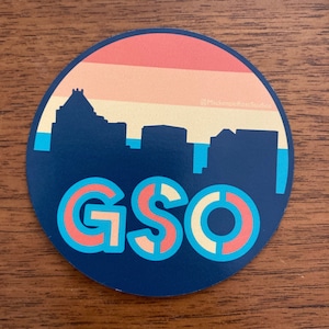 Vibrant Greensboro Skyline Magnet - Colorful Sunset Design - 3-inch Circle - Perfect for Your Fridge - Show Your Love for GSO!
