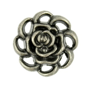 May include: A detailed, antique silver-colored metal button in the shape of a rose. The button features a central rose bud surrounded by multiple layers of petals, with an openwork design around the edges.