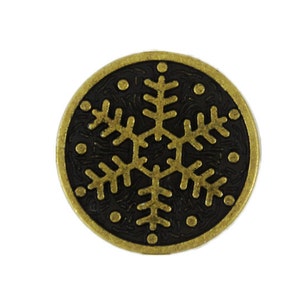 May include: A round, gold-colored metal button with a black snowflake design.