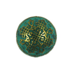 May include: A round, teal-colored button with a gold-colored, intricate design in the center.
