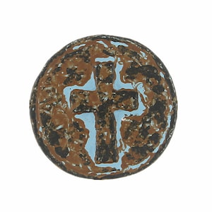 May include: A round, brown and blue ceramic tile with a raised, black cross in the center.