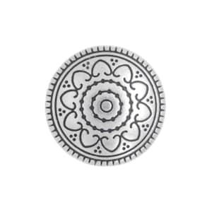 May include: A circular silver-toned button featuring a central dot surrounded by concentric rings and a repeating pattern of heart-shaped motifs. The outer edge is defined by a series of small, evenly spaced radial lines and decorative dots.