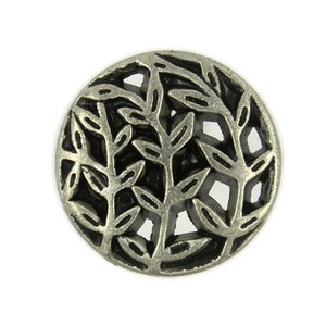 May include: Silver-toned metal button with a circular design featuring a cutout of a tree with branches and leaves.