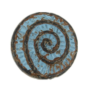 May include: A round, blue and brown ceramic tile with a spiral design. The tile has a rustic, distressed look.