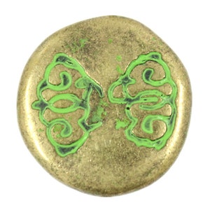 May include: A round, antique gold-colored button with a green, stylized butterfly design. The butterfly design is outlined in black. The button has a slightly textured surface.