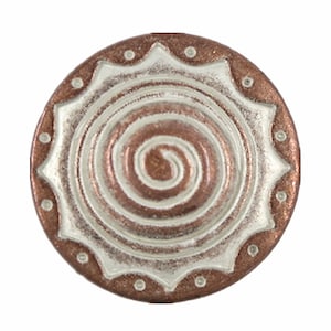 May include: A round, copper-colored button with a white spiral design and a white border with small dots.