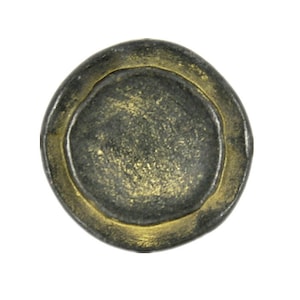 May include: A round, antique-style metal button with a dark gray center and a gold-colored outer rim. The button has a slightly textured surface and a worn appearance, suggesting age or vintage style. The button is isolated on a white background.