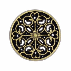May include: A round, gold-colored button with a black, intricate design. The design features a repeating pattern of hearts and swirls.