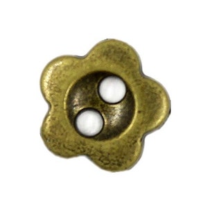 May include: A single, antique brass-coloured flower-shaped button with two white inset holes. The button has a detailed, textured surface and a slightly aged appearance, suggesting vintage or handcrafted quality. Ideal for sewing, crafts, or adding a unique touch to garments.