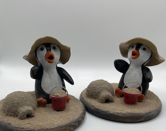 Polymer clay penguin building sand igloo