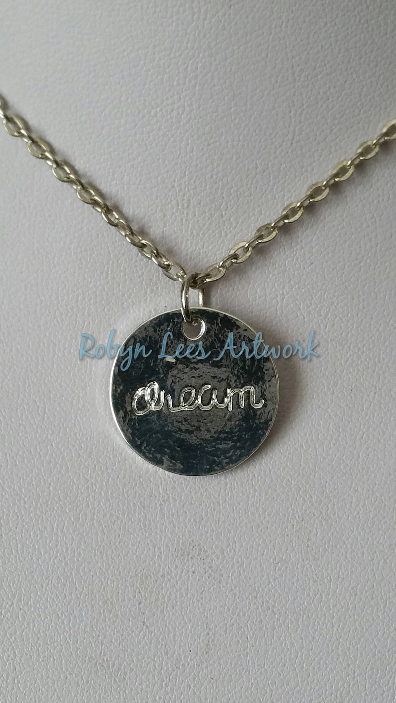 Small Stamped Silver Disc Double Sided Dream Word Necklace with Crescent Moon on Silver Crossed Chain or Black Faux Suede Cord