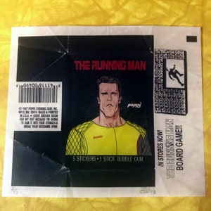 May include: A vintage sticker pack for The Running Man movie featuring Arnold Schwarzenegger. The sticker pack includes 5 stickers and 1 stick of bubble gum. The sticker pack is on a white background with black text and a black and white image of Arnold Schwarzenegger.