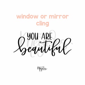 May include: Black and white calligraphy text that reads "You are beautiful" with the words "moments by Meyers" in smaller text below. The text is designed to be used as a window or mirror cling.