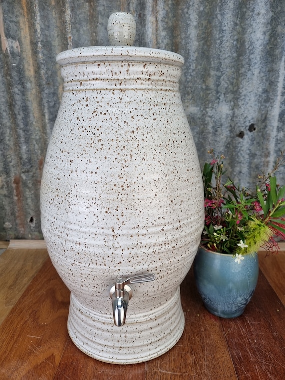 Ancient pottery water filter demonstration