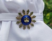 Royal blue, brass sunburst stock pin with pearls and fleur de lis design, brooch