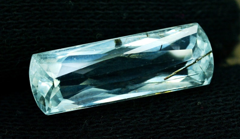 14.95 cts Flawless Untreated Aquamarine Gemstone with tourmaline inclusions from Pakistan 25*8*7 mm