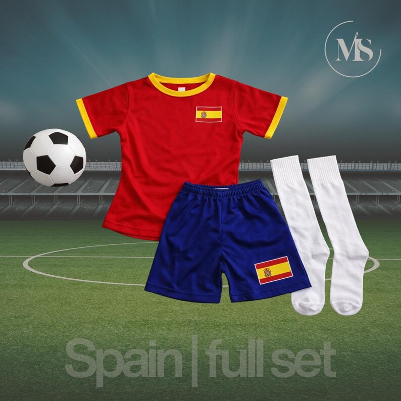 May include: A complete Spain soccer kit, including a red jersey with yellow trim and the Spanish flag, blue shorts, white socks, and a soccer ball. The text "Spain | full set" is at the bottom.